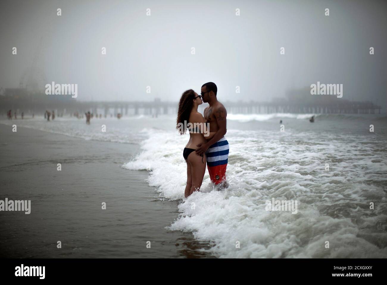 Jon Robnett 27 R And Noelle Sigua 22 From Los Angeles Kiss As They Cool Off In The Pacific Ocean During A Heat Wave Sweeping The Southwest United States In Santa Monica