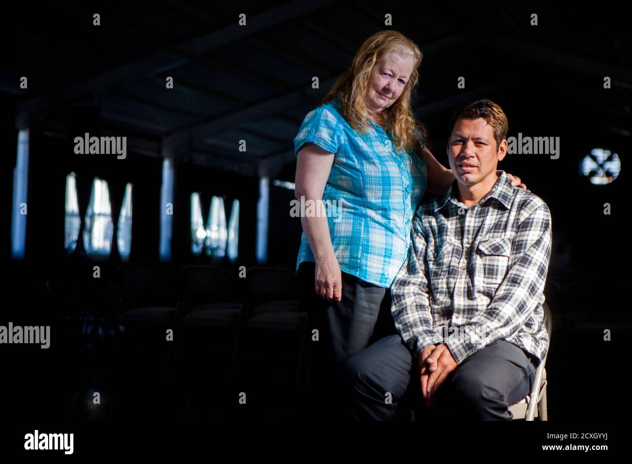 Kathy Amaya poses for a portrait with her son David Amaya at Iglesia de  Cristo Ministerios Llamada Final in San Diego, California November 24,  2013. Amaya was abducted as a child to