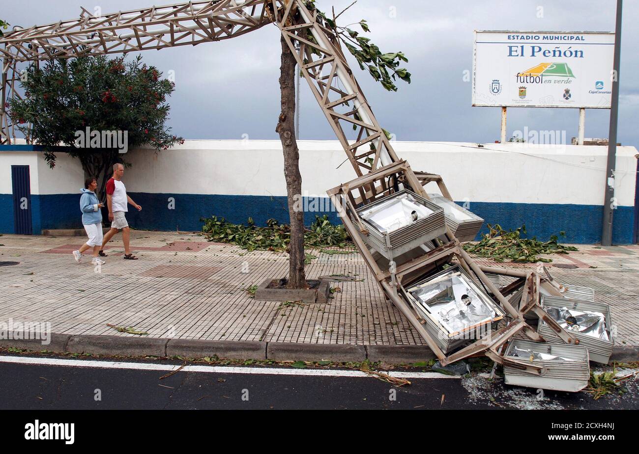 A section of lights from a municipal stadium which were blown down by high  winds hangs over the pavement in Puerto de la Cruz in Tenerife, in Spain's  Canary Islands November 29,
