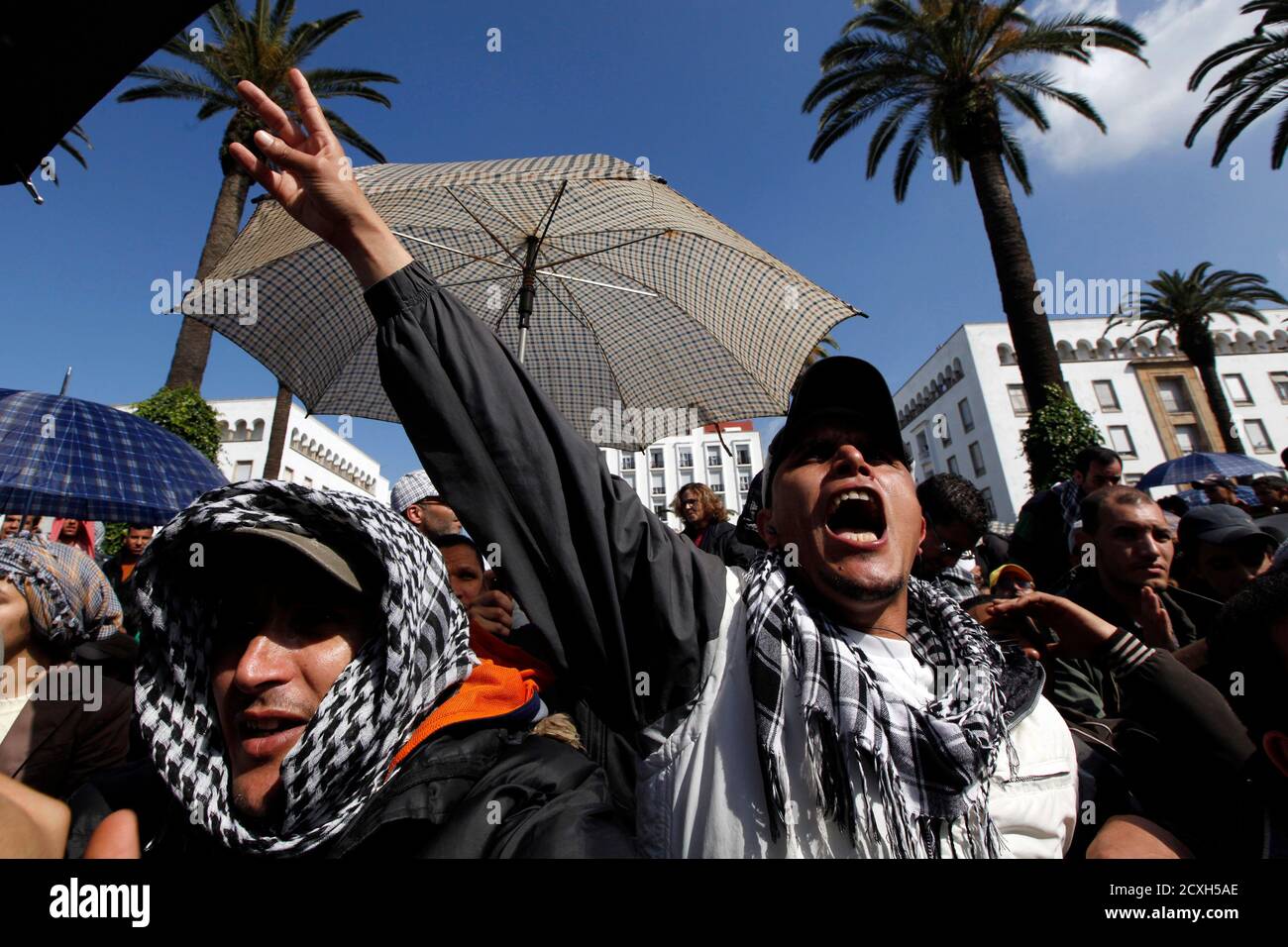 A man chants slogans during a protest in Rabat February 20, 2011. Thousands of protesters took to the streets in Morocco on Sunday demanding King Mohammed give up some of his powers, dismiss the government and clamp down on corruption.  EUTERS/Youssef Boudlal            (MOROCCO - Tags: POLITICS CIVIL UNREST) Stock Photo