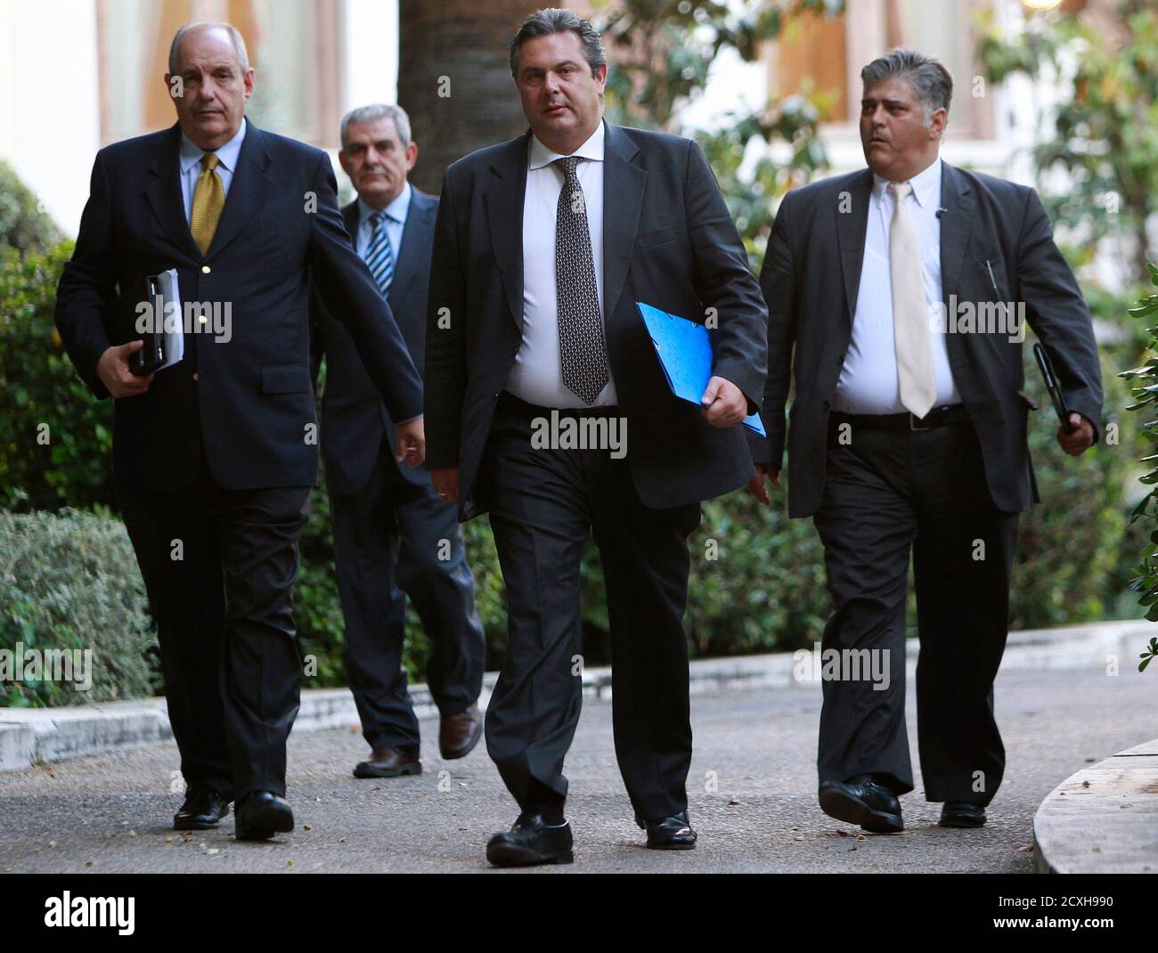 Leader of the Independent Greeks party Panos Kammenos (2nd R) leaves the  presidential palace in Athens May 13, 2012. Greek political leaders on  Sunday ignored a final plea from the president to
