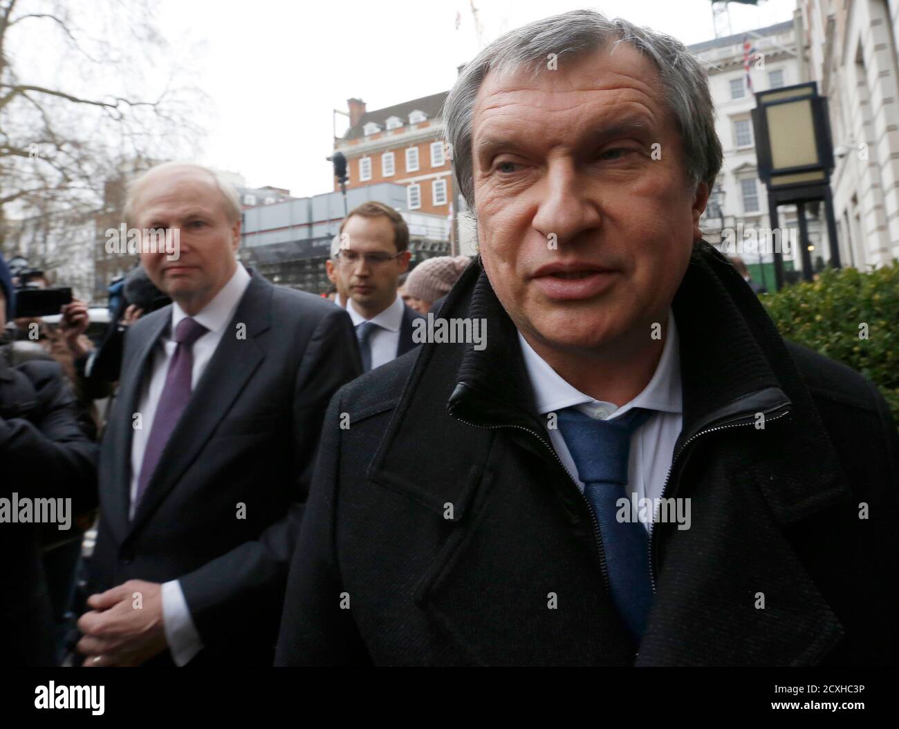 British Petroleum CEO Bob Dudley (L) and Rosneft CEO Igor Sechin arrive outside the BP headquarters in central London March 21, 2013. Russian state oil company Rosneft closed its deal to buy TNK-BP from UK-based BP and four tycoons on Thursday, releasing $40 billion cash to the sellers and becoming a bigger oil producer than Exxon Mobil. The $55 billion deal, which also gives BP a near 20 percent stake in Rosneft, was announced last year after months of on-off negotiations. It is the biggest in Russia's corporate history.. REUTERS/Olivia Harris (BRITAIN - Tags: BUSINESS POLITICS ENERGY) Stock Photo