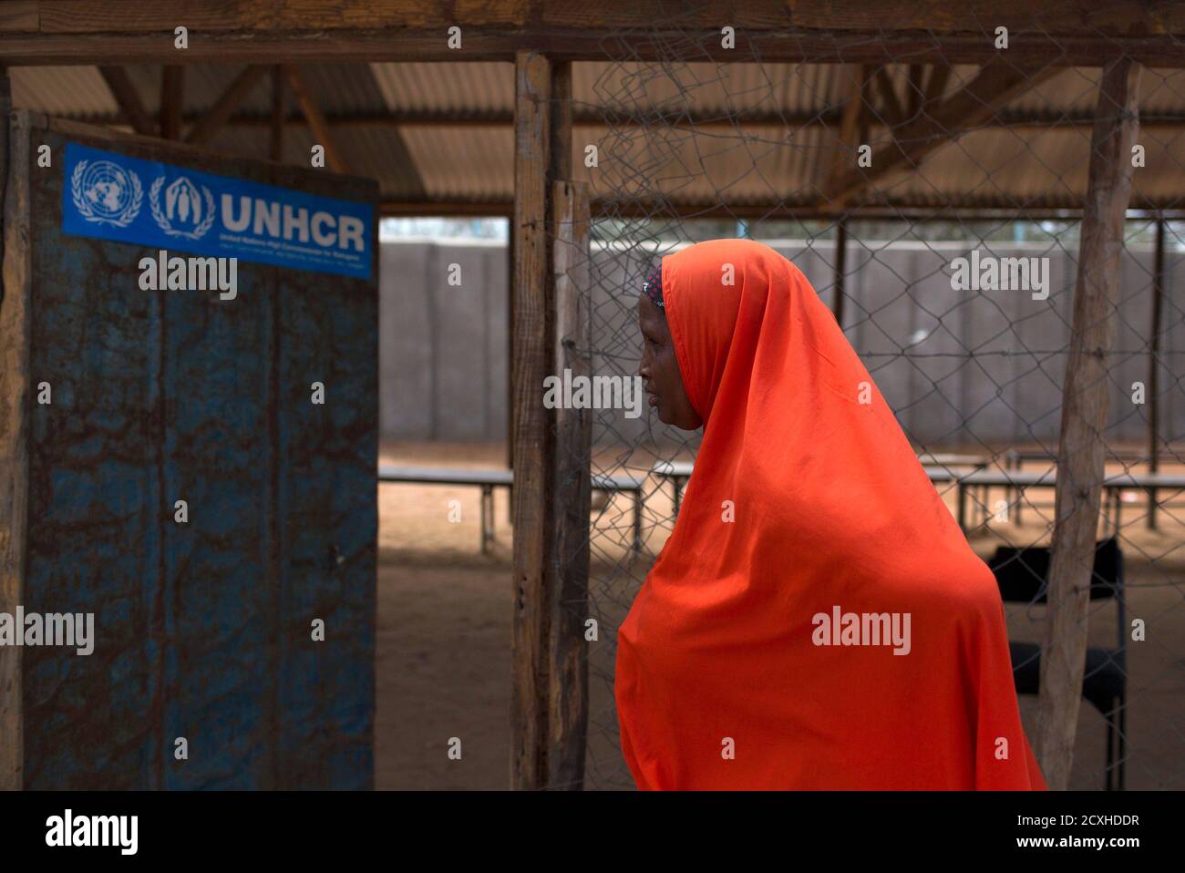 A woman walks past a UNHCR field office in Dagahale, one of the several refugee settlements in Dadaab, Garissa County, northeastern Kenya, October 7, 2013.  REUTERS/Siegfried Modola  (KENYA - Tags: SOCIETY IMMIGRATION POLITICS) Stock Photo