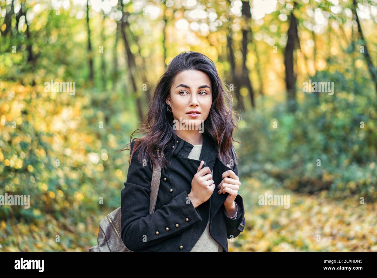 Pretty long hair brunette girl relaxing in the park, autumn time Stock ...