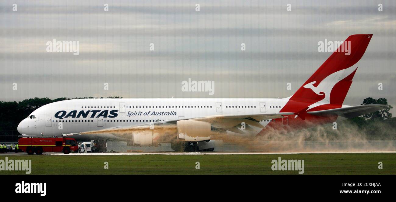 Qantas Airways 380 Passenger Plane Flight Qf32 Is Sprayed By Rescue Services After Making An Emergency Landing At Changi Airport In Singapore November 4 10 The Airbus A380 Which Had Originated In
