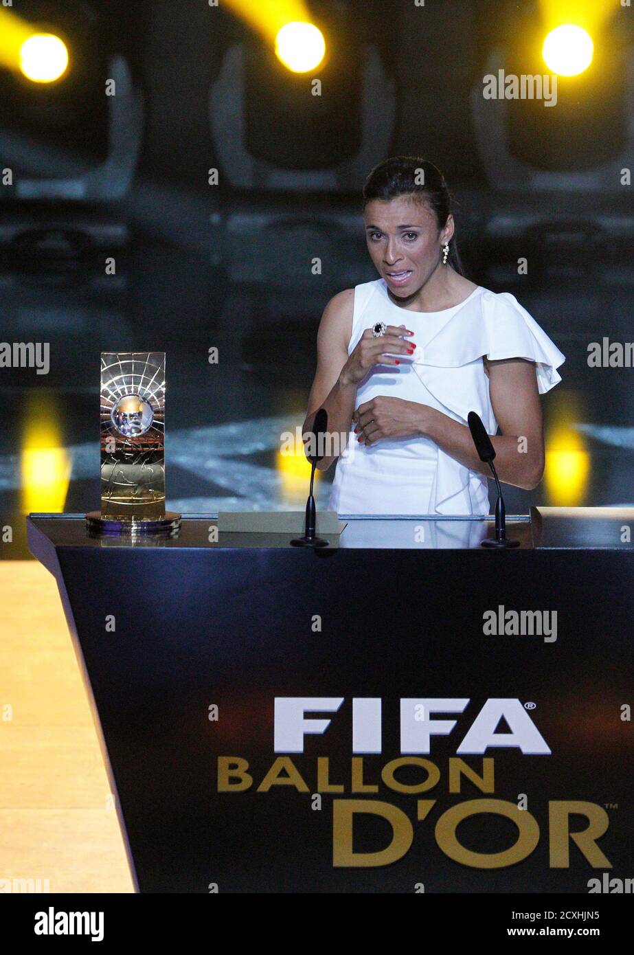 Marta of Brazil, FIFA Women's World Player 2010 makes a speech as she  stands next to her trophy during the FIFA Ballon d'Or 2010 soccer awards  ceremony in Zurich, January 10, 2011.