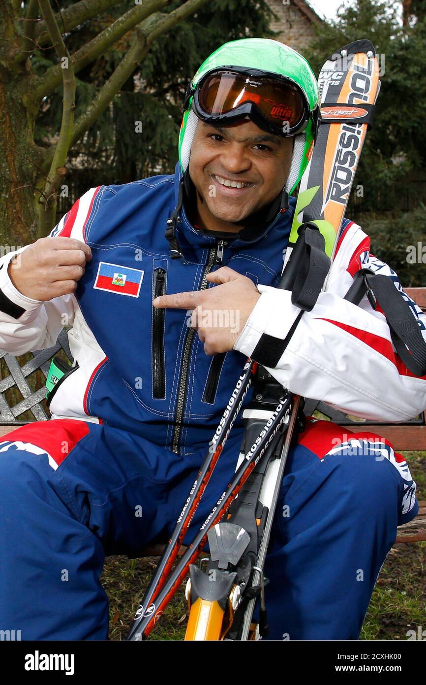 Jean-Pierre Roy, an IT specialist and President and only member of the  Haitian Ski Federation, poses with his official ski suit for Reuters in his  garden in Orgerus, near Paris, February 4,