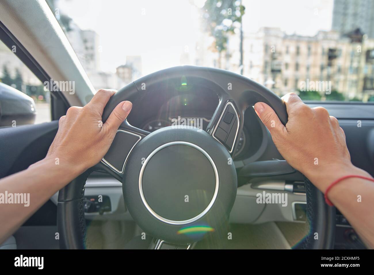 Female hands on steering wheel hi-res stock photography and images - Alamy