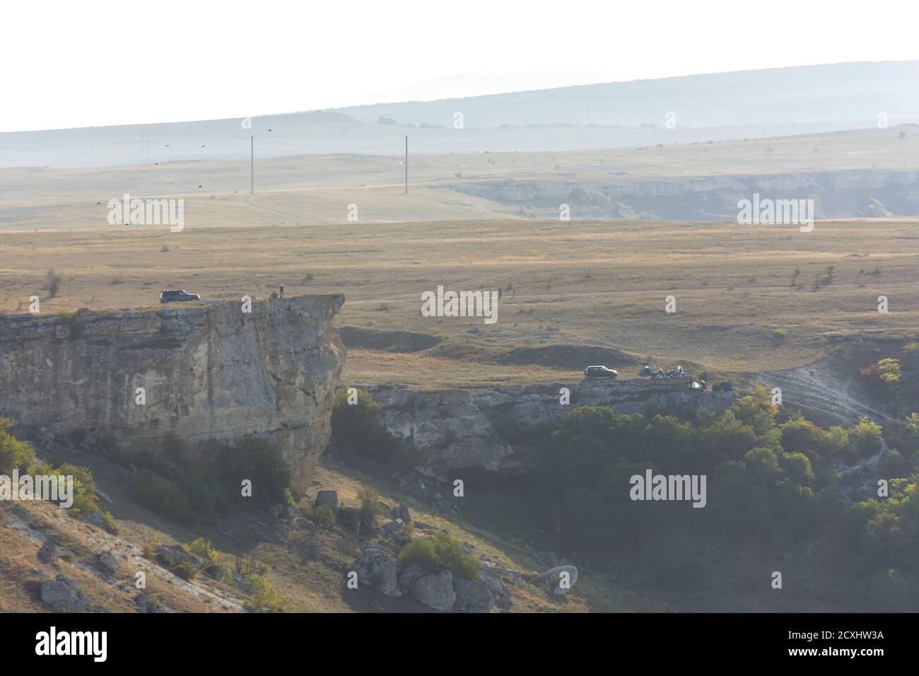 Cars on the edge of a cliff. People with tents relax in nature. Autumn atmospheric landscape with people. Belaya Skala in Belogorsk Crimea on 19 Septe Stock Photo