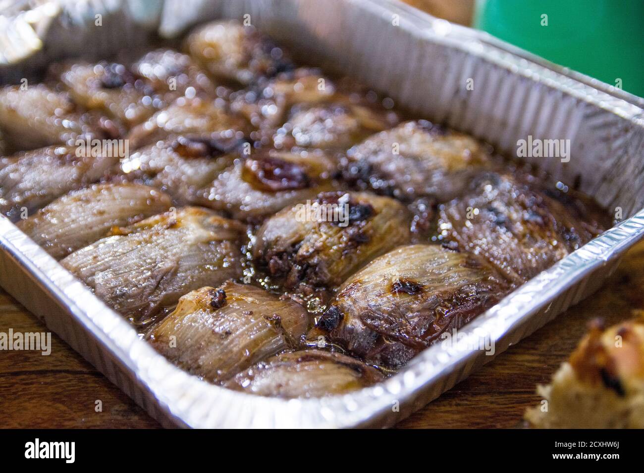 Baked stuffed Onions lays in a metal container Stock Photo Alamy