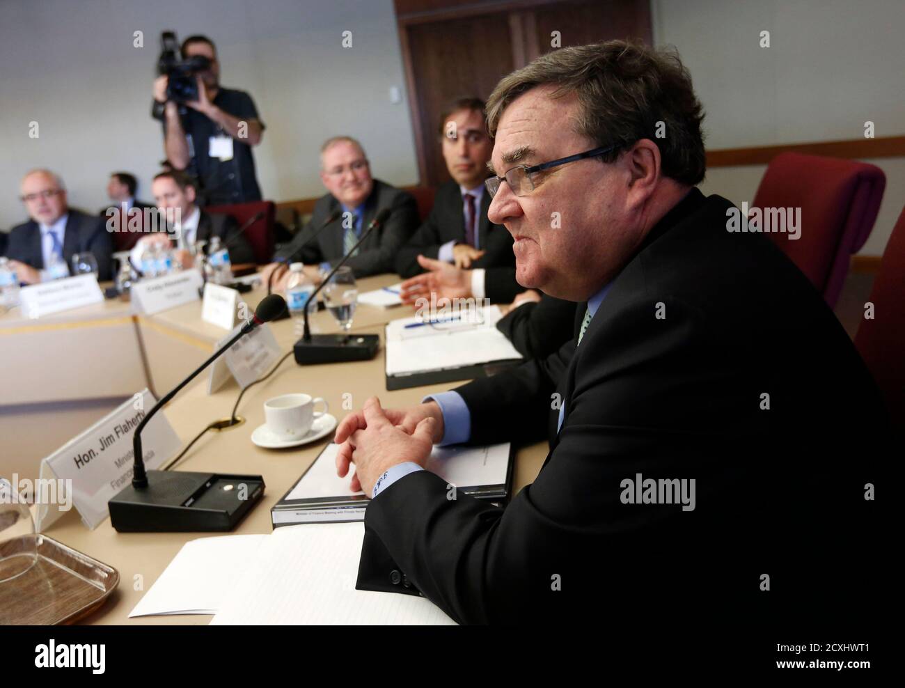 Canada's Finance Minister Jim Flaherty (R) meets with private sector economists in Ottawa March 8, 2013.     REUTERS/Chris Wattie     (CANADA - Tags: POLITICS BUSINESS) Stock Photo