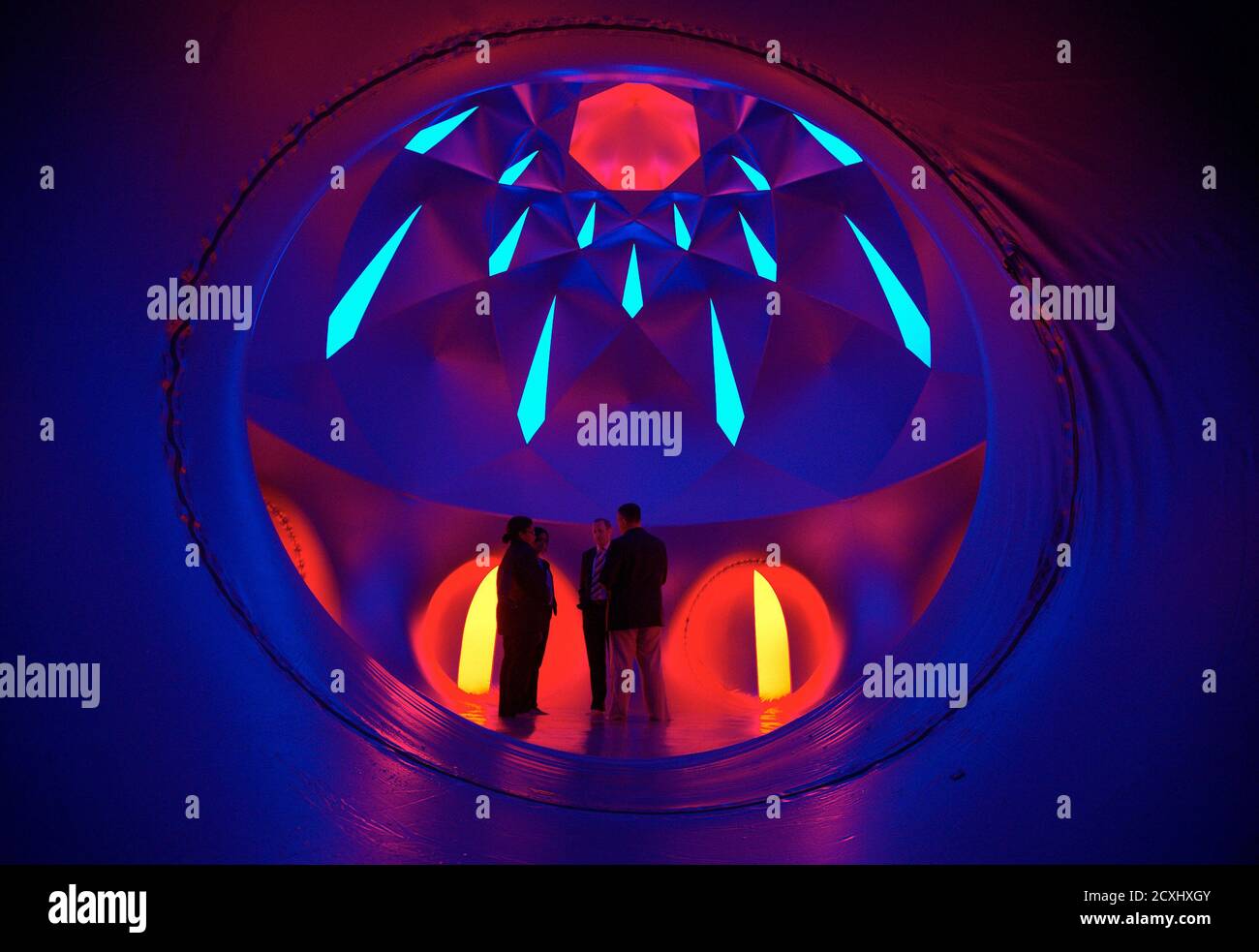 People visit the Luminarium, an inflatable sculpture of British artist Alan  Parkinson, before its opening on the ground of the United Nations European  headquarters in Geneva June 10, 2013. Until June 14,