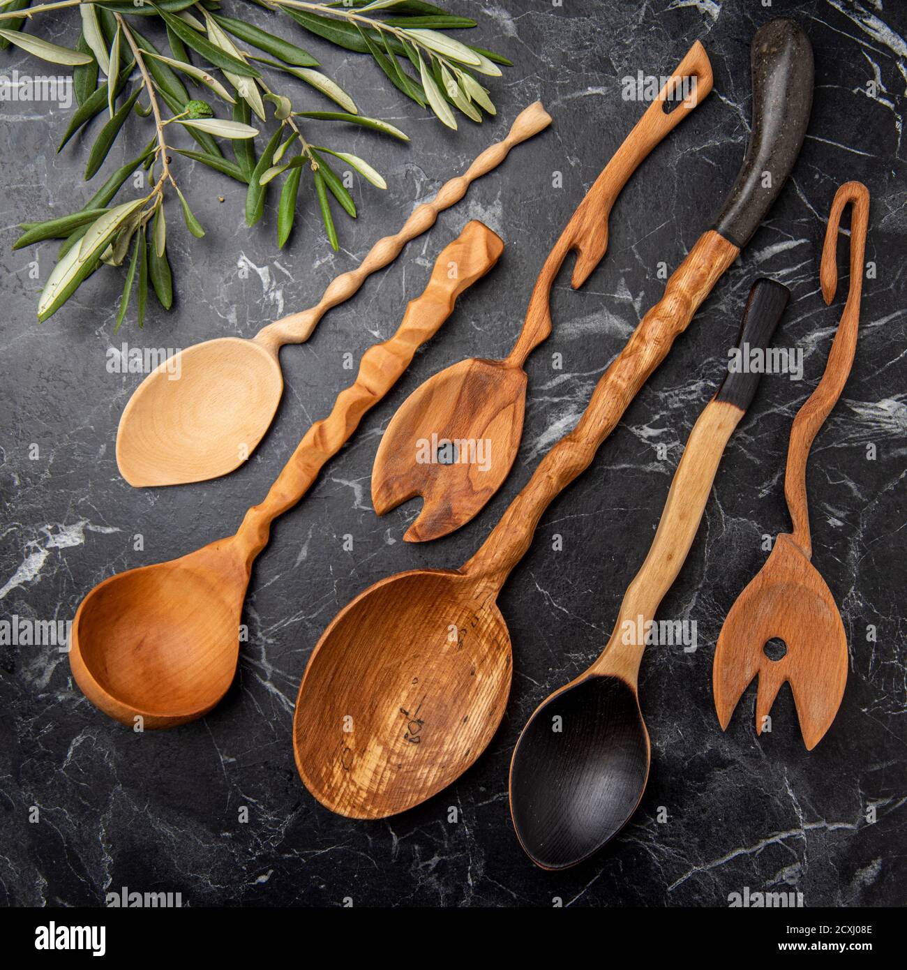 wooden kitchen tools on black marble in the kitchen Stock Photo