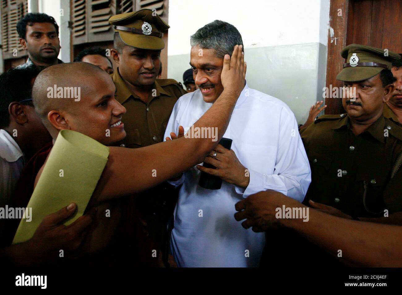 A Buddhist Monk Blesses Jailed Former Army Chief Sarath Fonseka As He  Arrives At The High Court In Colombo October 4, 2010. Sri Lanka's President  Mahinda Rajapaksa Last Week Upheld A Military