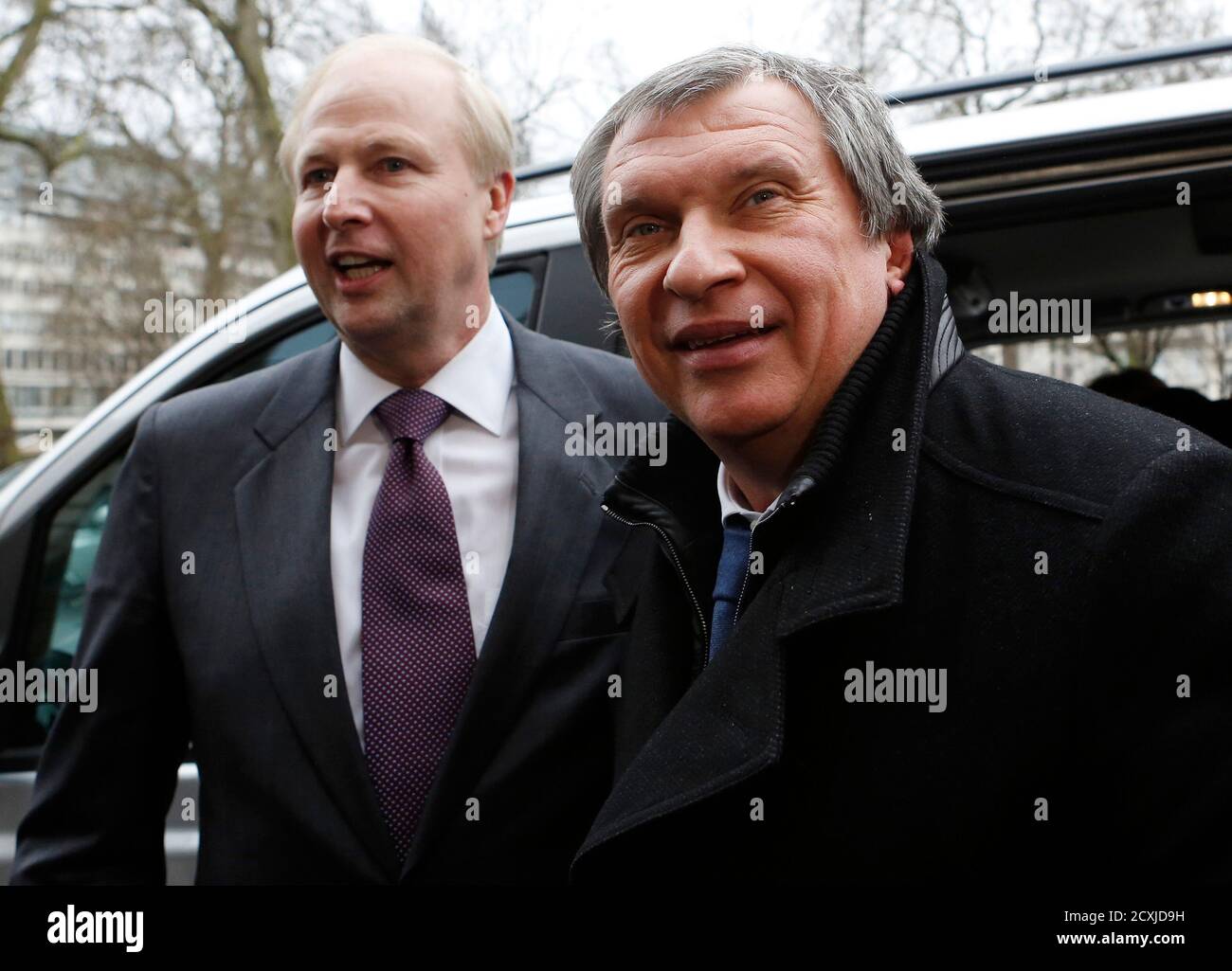 British Petroleum CEO Bob Dudley (L) and Rosneft CEO Igor Sechin (R) arrive outside the BP headquarters in central London March 21, 2013. Russian state oil company Rosneft closed its deal to buy TNK-BP from UK-based BP and four tycoons on Thursday, releasing $40 billion cash to the sellers and becoming a bigger oil producer than Exxon Mobil. The $55 billion deal, which also gives BP a near 20 percent stake in Rosneft, was announced last year after months of on-off negotiations. It is the biggest in Russia's corporate history.. REUTERS/Olivia Harris (BRITAIN - Tags: BUSINESS POLITICS ENERGY) Stock Photo