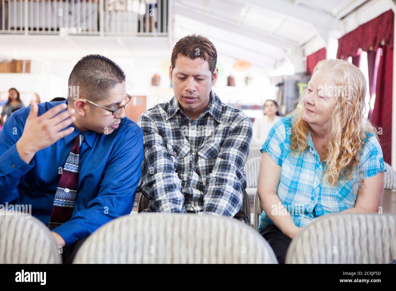 David Amaya and his mother Kathy Amaya talk to each other through translator Juan Soto (L) at Iglesia de Cristo Ministerios Llamada Final in San Diego, California November 24, 2013. Amaya was David Amaya and his mother Kathy Amaya talk to each other through translator Juan Soto (L) at Iglesia de Cristo Ministerios Llamada Final in San Diego, California November 24, 2013. Amaya was