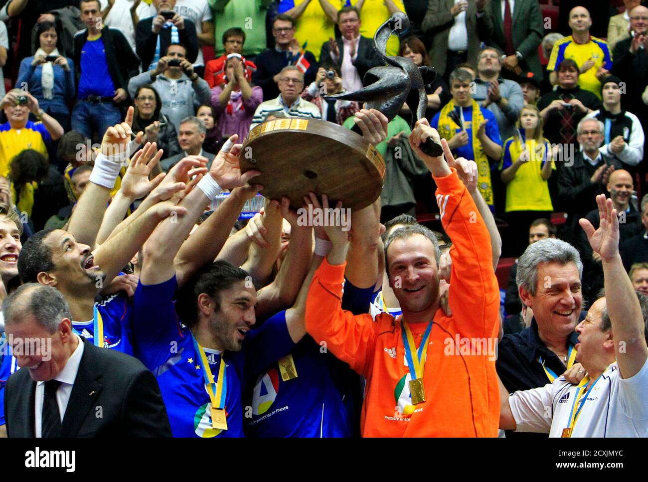 France's national handball team players celebrate on the winners podium