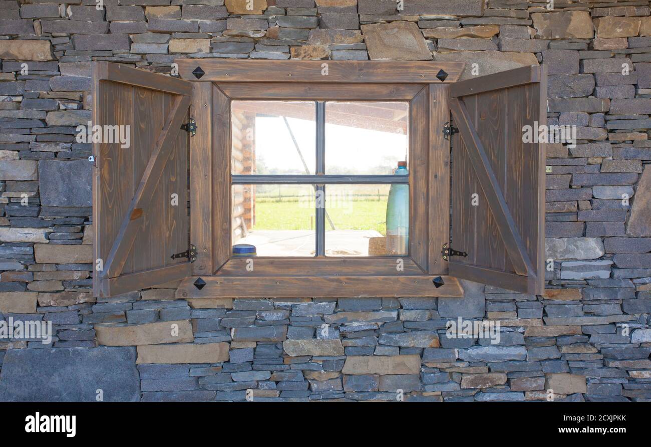 wooden window on stone wall background Stock Photo - Alamy