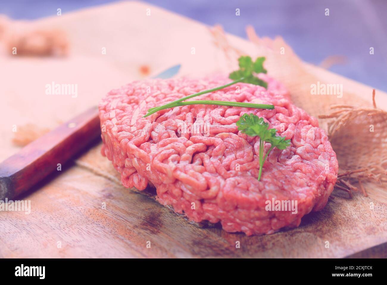 Red burger meat closeup on black background Stock Photo