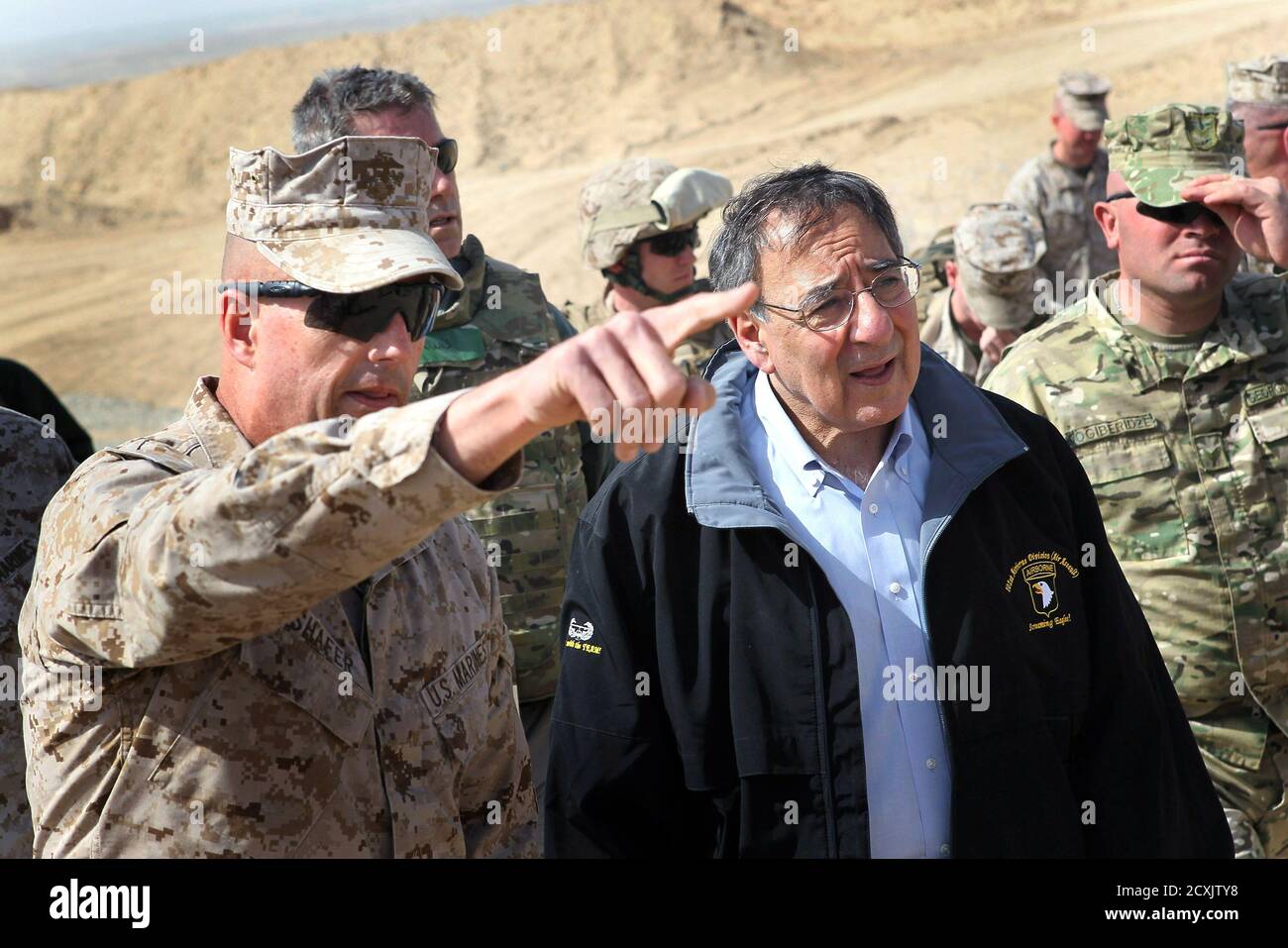 U.S. Defense Secretary Leon Panetta is greeted by Col. John Shafer (L) with RTC 6 after arriving to greet troops at Forward Operating Base Shukvani, Afghanistan March 14, 2012. Panetta told troops in Afghanistan on Wednesday that the massacre of 16 Afghan civilians by an American soldier should not deter them from their mission to secure the country ahead of a 2014 NATO withdrawal deadline. REUTERS/Scott Olson/Pool (AFGHANISTAN - Tags: POLITICS MILITARY) Stock Photo