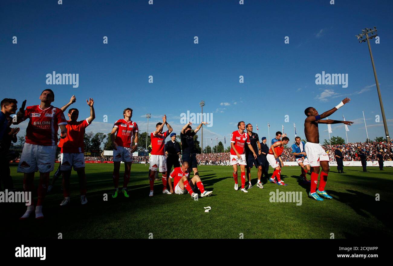 FC Sion's players celebrate after they qualified for the Swiss Super  League, after their promotion and relegation soccer match against FC Aarau,  in Aarau May 28, 2012. REUTERS/Michael Buholzer (SWITZERLAND - Tags: