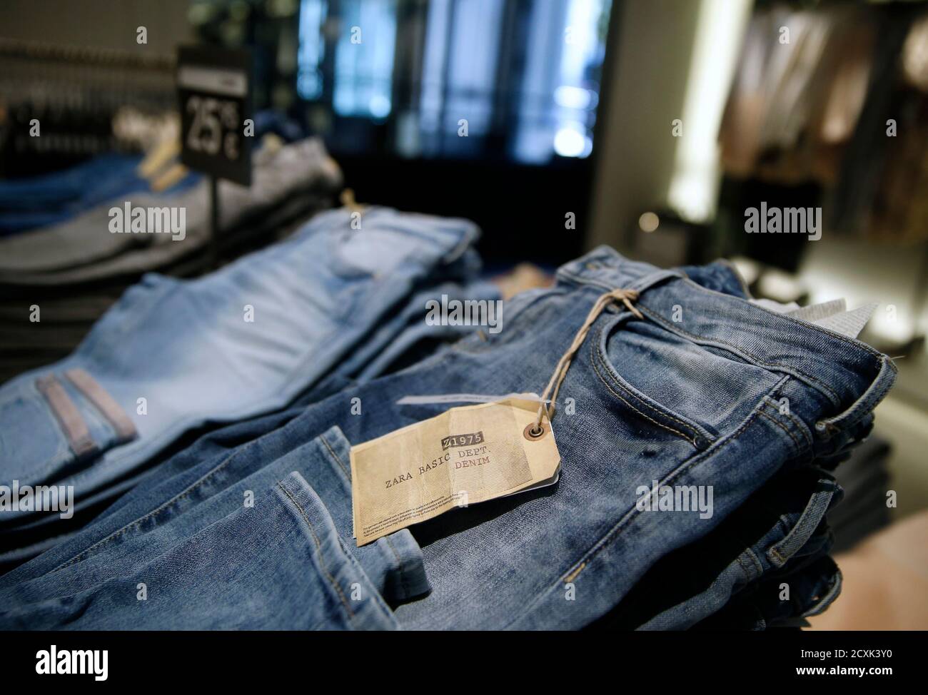 Jeans are displayed at a Zara store in Madrid March 18, 2014. Inditex, the  world's biggest fashion retailer, will accelerate investment in 2014 to  open more new stores after results last year