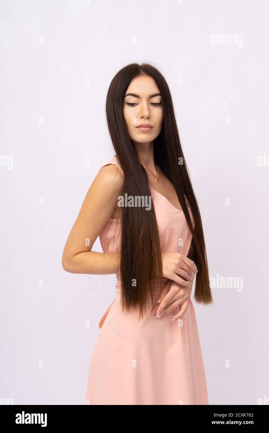Young woman with long hair. Brunette Stock Photo