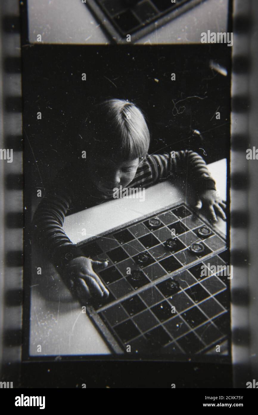 Fine 1970s vintage black and white photography of kids playing checkers