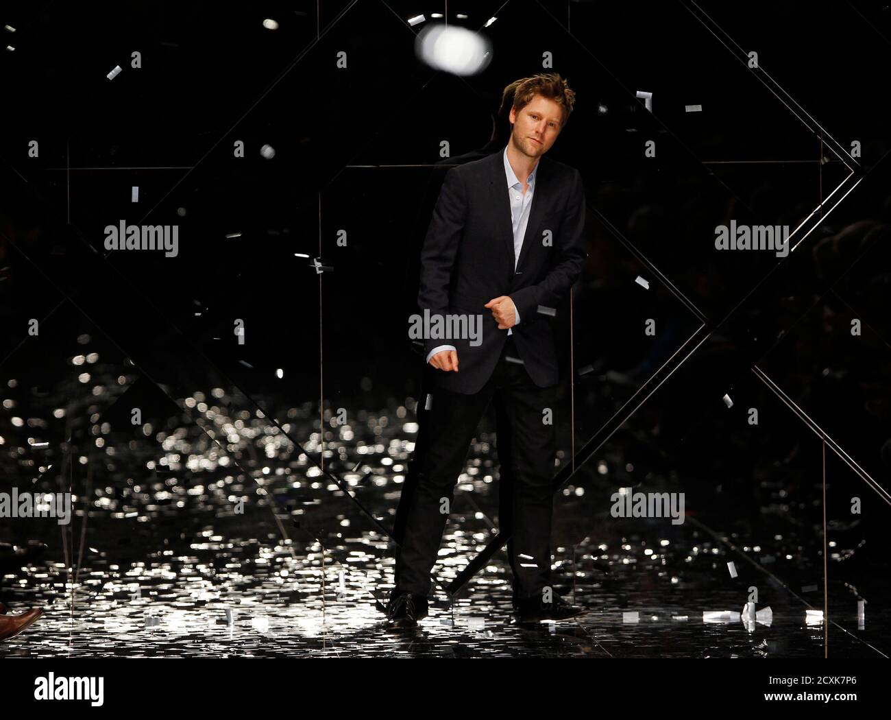 Christopher Bailey, creative director of the British fashion house Burberry, walks on the catwalk after the presentation of the Burberry Prorsum 2011 Spring/Summer collection at London Fashion Week September 21, 2010. REUTERS/Suzanne Plunkett (BRITAIN - Tags: FASHION) Stock Photo