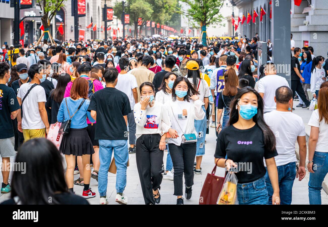 Wuhan China , 1 October 2020 : Crowd of people wearing surgical face mask on the 2020 China national day and first day of golden week holidays in Jian Stock Photo