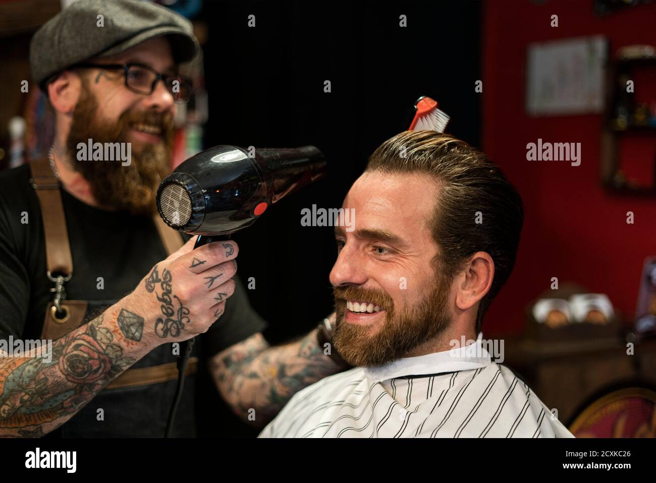 Combing hair styling in barber hi-res stock photography and images - Alamy