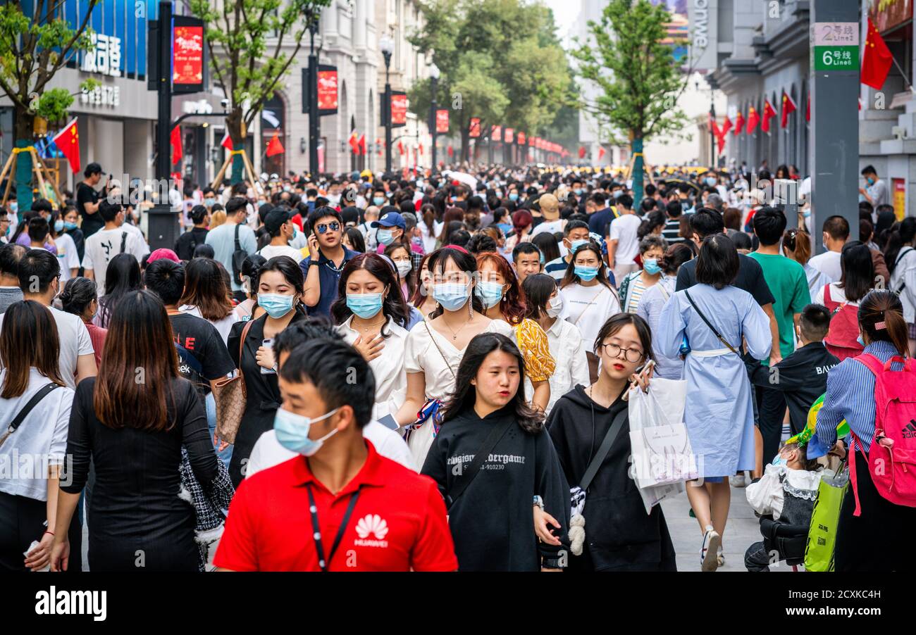 Wuhan China , 1 October 2020 : Crowd of people wearing surgical face mask on the 2020 China national day and first day of golden week holidays in Jian Stock Photo