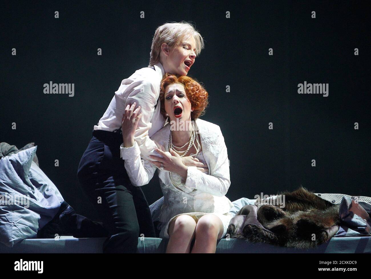 Singers Elina Garanca (L) and Juliane Banse perform on stage during a dress rehearsal of Wolfgang Amadeus Mozart's opera 'La clemenza di Tito' at the state opera in Vienna May 14, 2012. The opera is conducted by Louis Langree and will premiere on May 17, 2012.  REUTERS/Lisi Niesner  (AUSTRIA - Tags: ENTERTAINMENT) Stock Photo