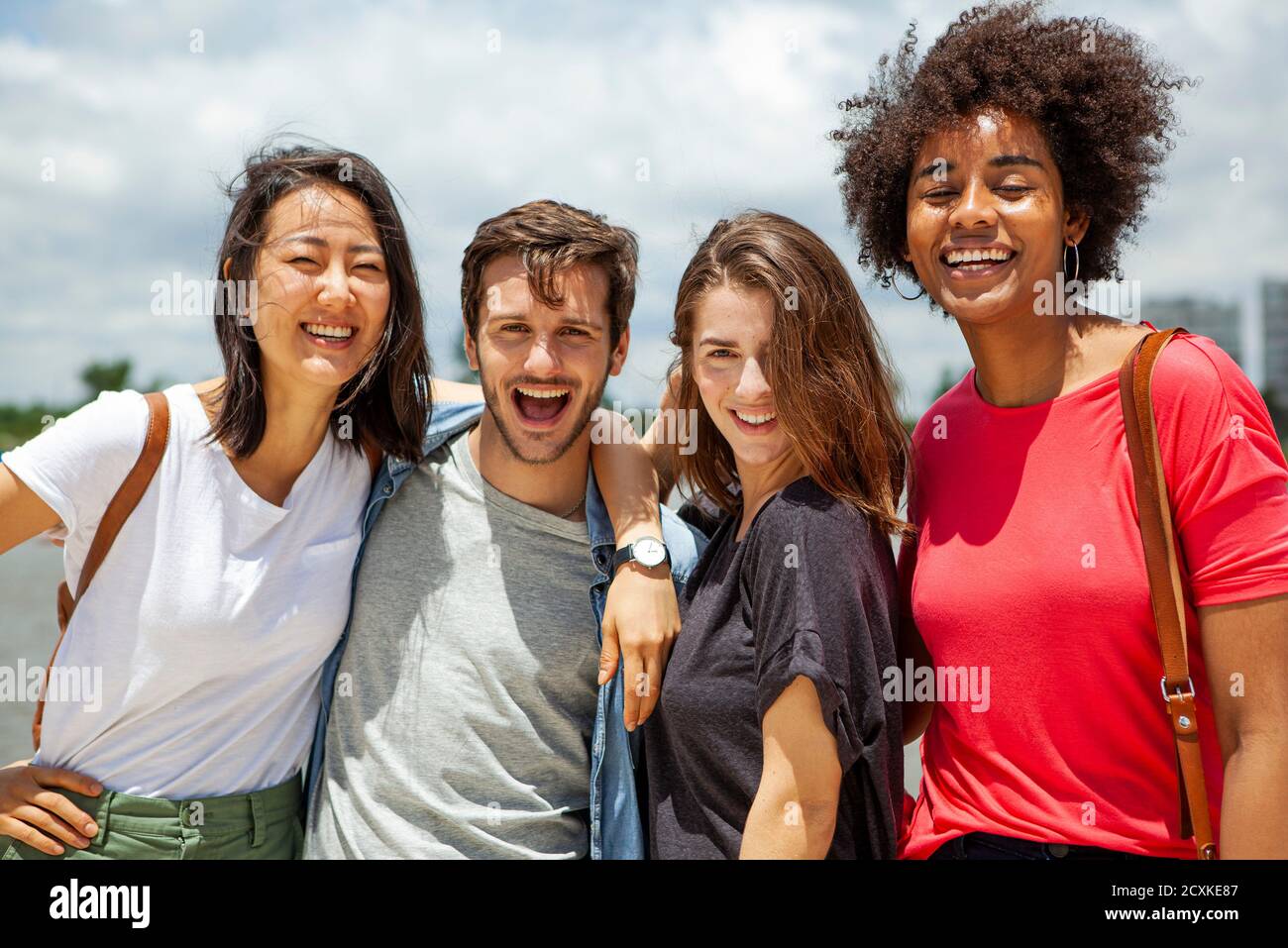 Group of young friends having fun outdoors Stock Photo - Alamy