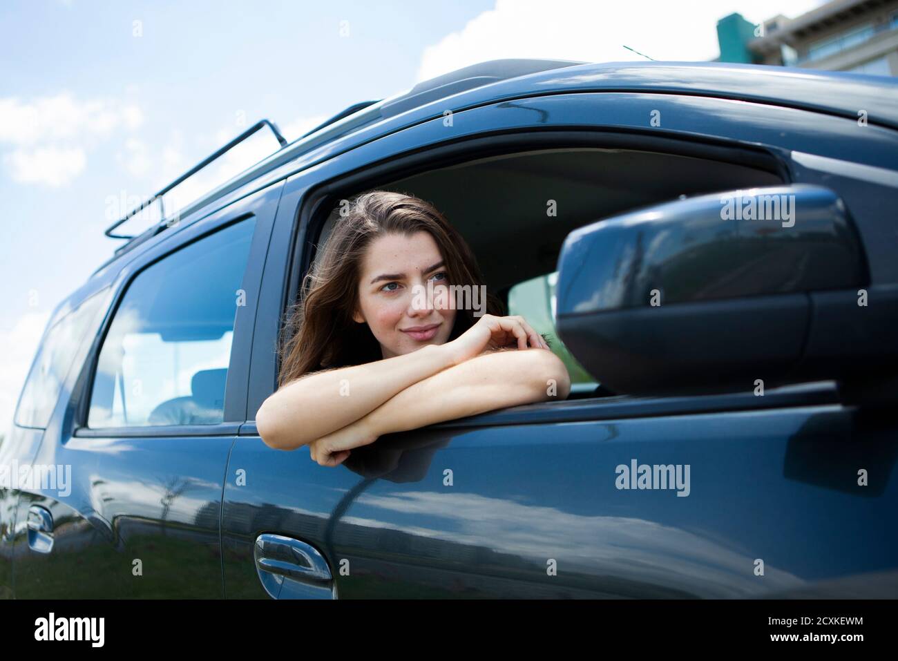 Car front view woman sitting hi-res stock photography and images - Alamy