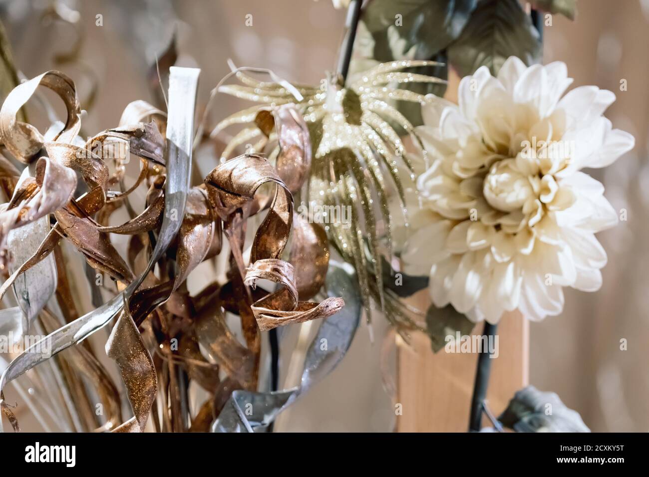 Christmas decorations - artificial flowers on blurred background.Selective focus. Stock Photo