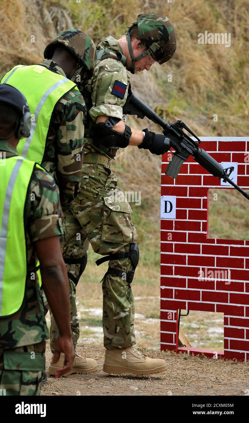 Britain S Prince Harry R Loads An M 16 Assault Rifle At The Start Of A Live Firing Exercise At The Up Park Camp In Kingston Jamaica March 7 12 The Prince Is On A