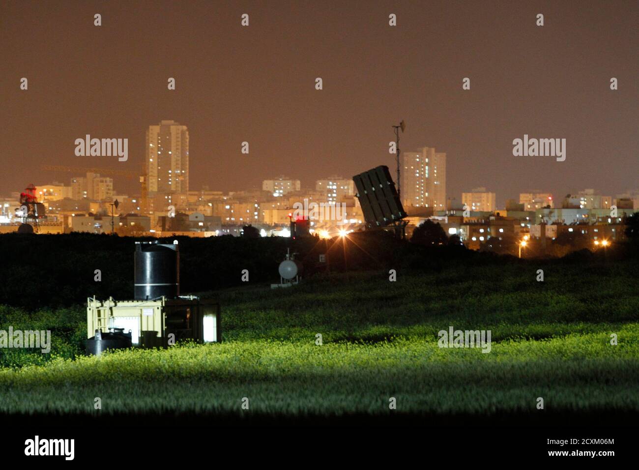 A launcher, part of the Iron Dome rocket shield system, is deployed in a field near the southern city of Ashdod March 10, 2012. Israeli warplanes killed five militants in Gaza on Saturday, the second day of cross-border violence in which Palestinian fighters have fired dozens of rockets into Israel, both sides said. REUTERS/Baz Ratner (ISRAEL - Tags: POLITICS CIVIL UNREST) Stock Photo