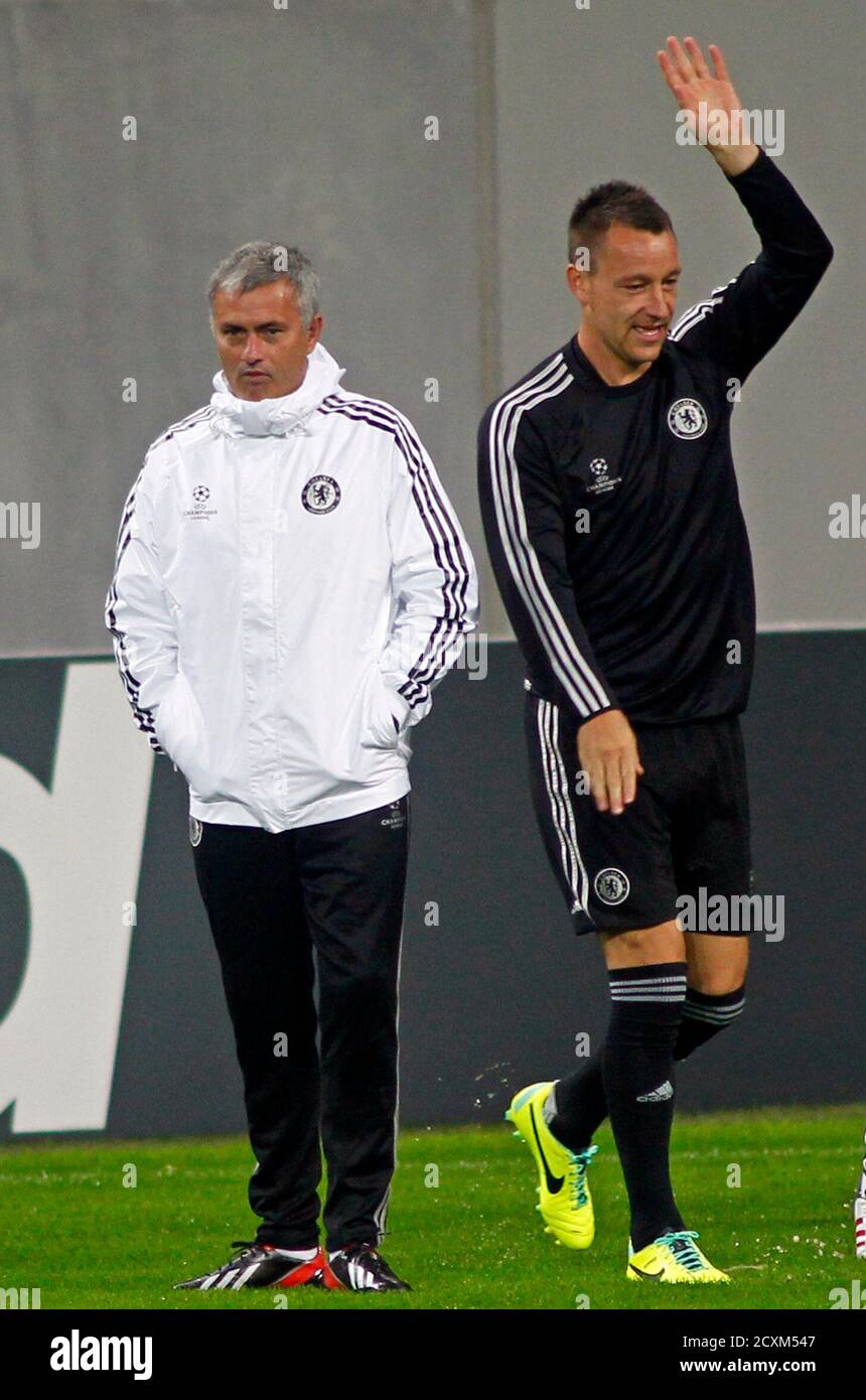 Chelsea's manager Jose Mourinho and John Terry take part in a training  session in Bucharest September 30, 2013. Chelsea will play against Steaua  Bucharest in a Champions League soccer match at National