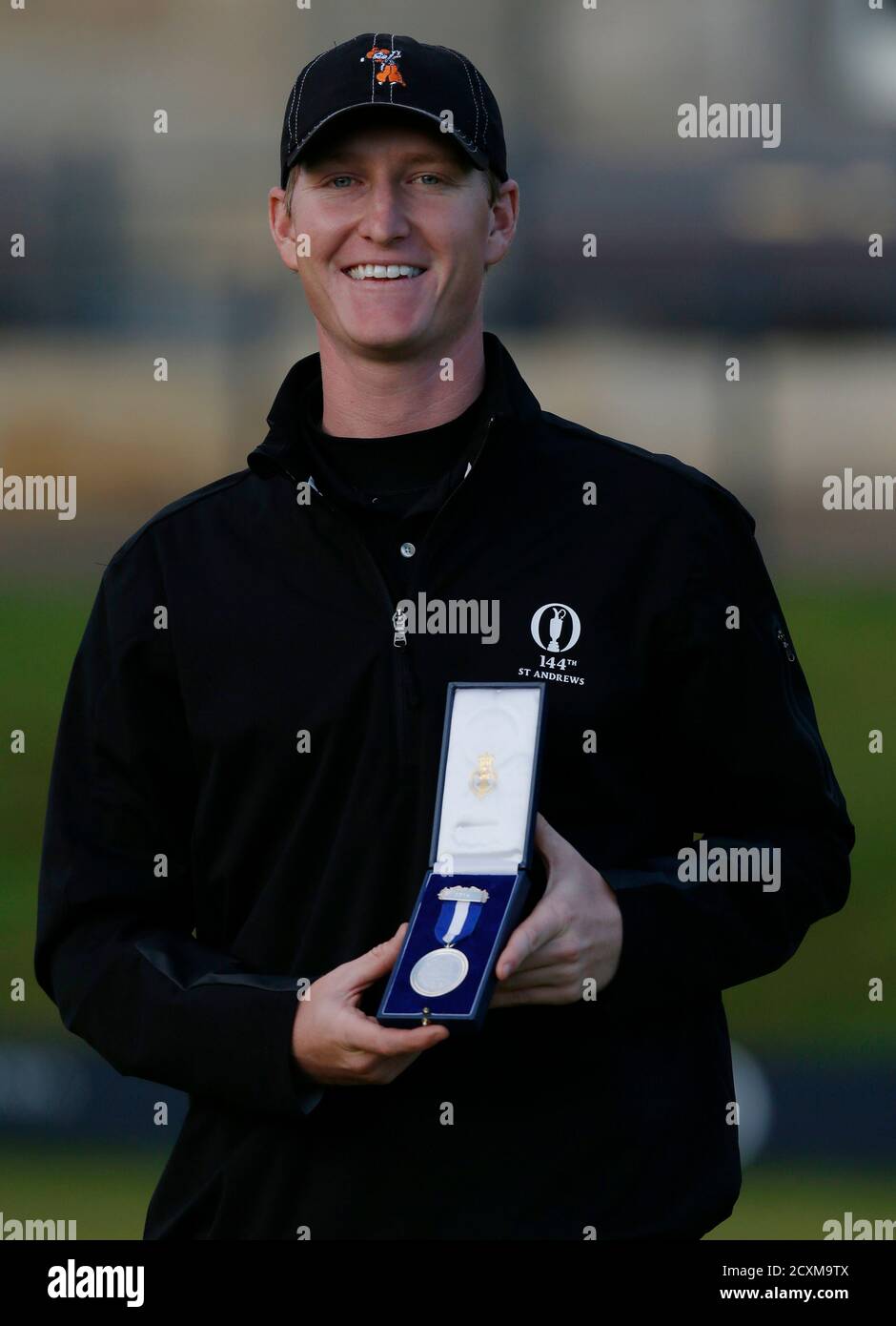 Jordan Niebrugge of the U.S. celebrates with the silver medal after finishing as the leading amateur of the British Open golf championship on the Old Course in St. Andrews, Scotland, July 20, 2015.       REUTERS/Russell Cheyne Stock Photo