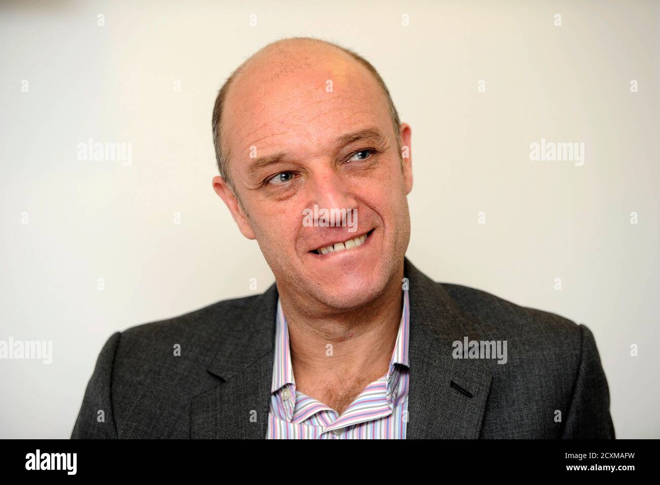 The CEO of French Radio London, Pascal Grierson, talks during an interview  with Reuters, in London November 23, 2010. Among stereotypes the British  and the French like to cultivate about each other