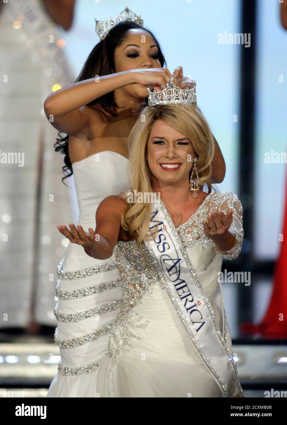 Miss Nebraska Teresa Scanlan, 17, reacts as she is crowned Miss America 2011 by Caressa Cameron, Miss America 2010, during the Miss America Pageant at the Theatre for the Performing Arts at the Planet Hollywood Resort and Casino in Las Vegas, Nevada, January 15, 2011. REUTERS/Steve Marcus (UNITED STATES - Tags: ENTERTAINMENT) Stock Photo