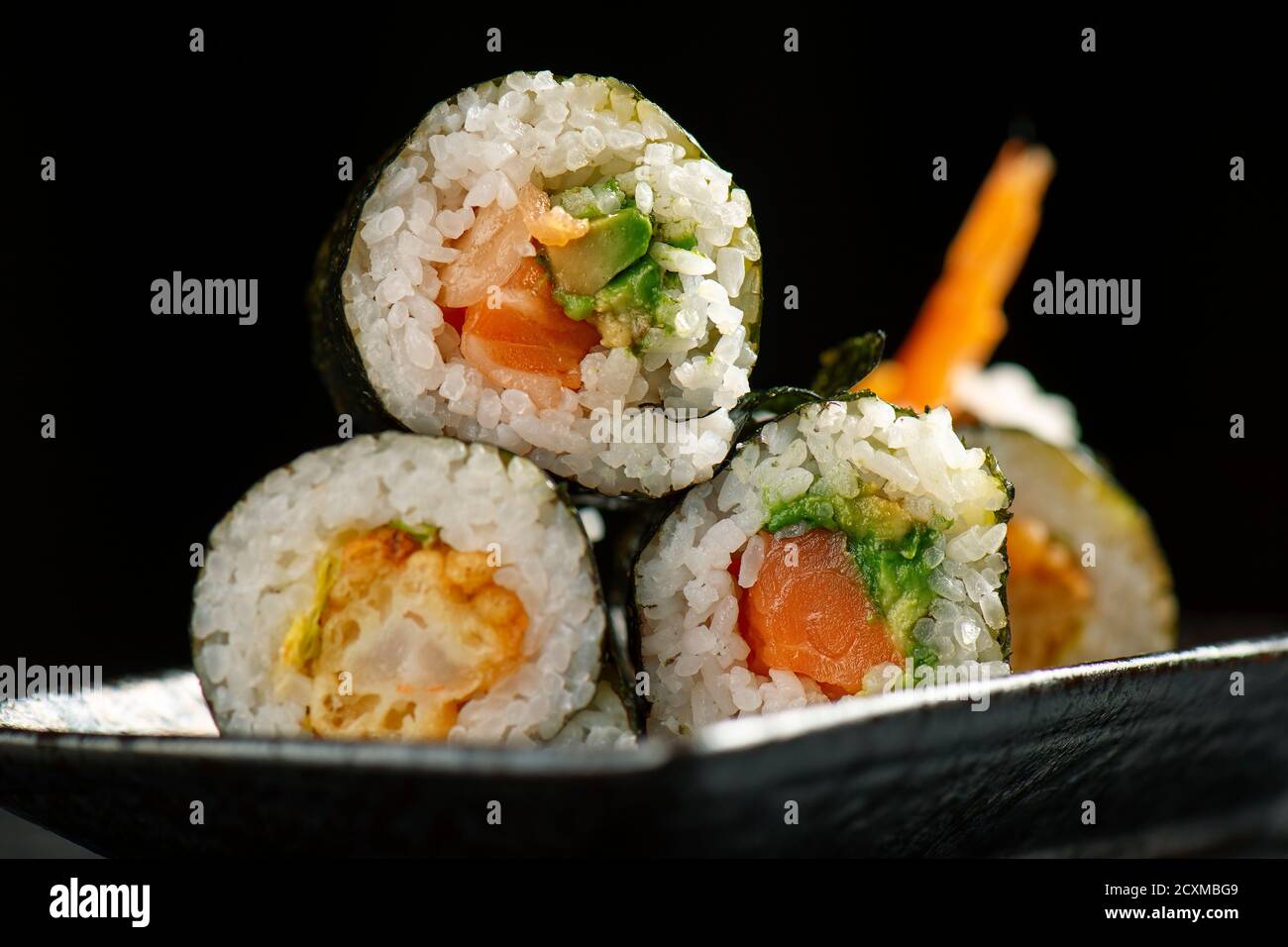 Prawn Tempura and Salmon Avocado Sushi Rolls. Detailed closeup macro