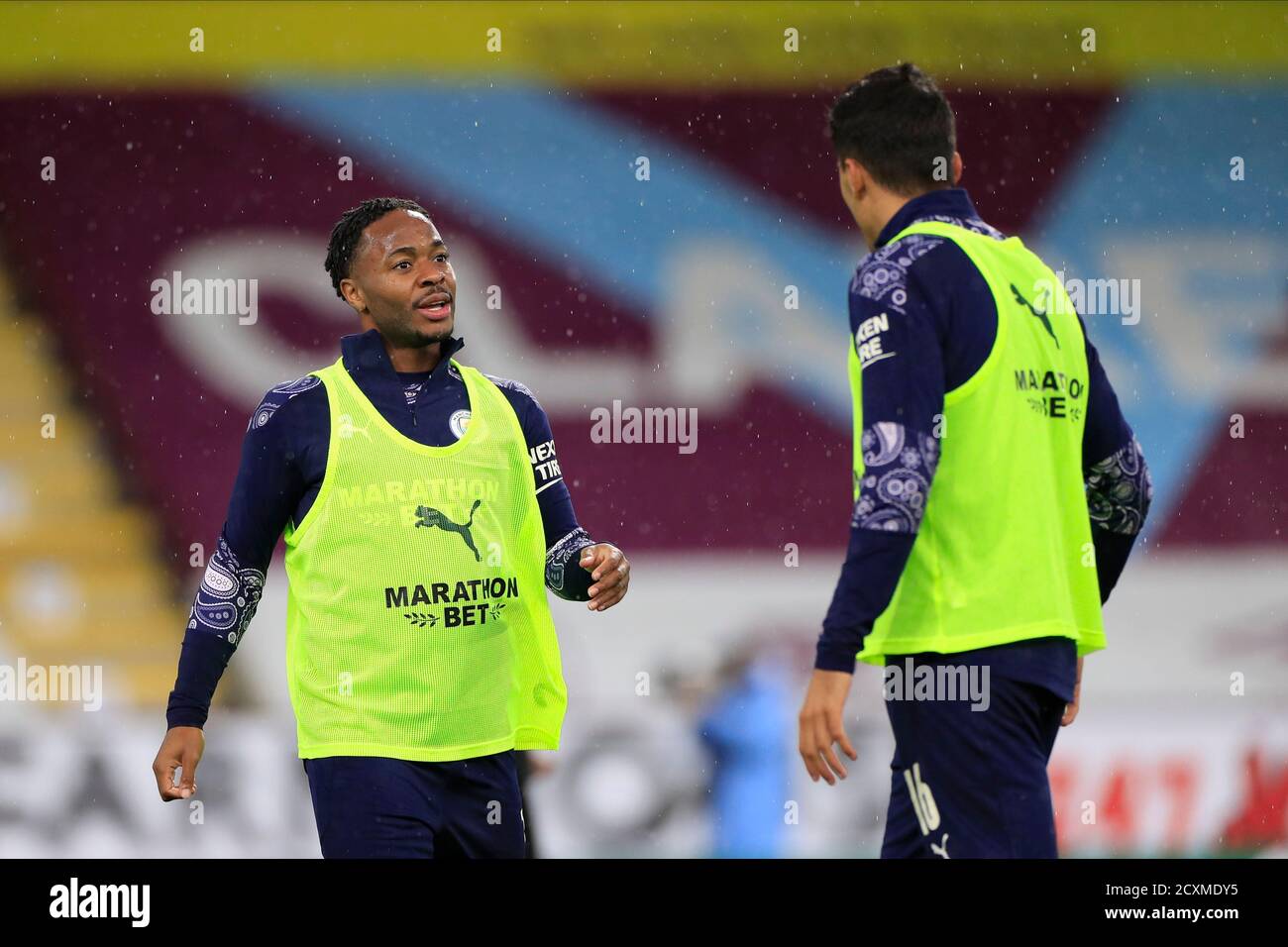 Raheem Sterling (7) and Rodrigo (16) of Manchester City chat before the game Stock Photo