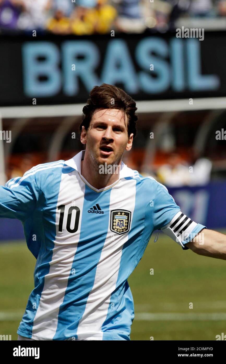 Argentina forward Lionel Messi celebrates his second goal against Brazil  during their international friendly soccer match in East Rutherford, New  Jersey, June 9, 2012. REUTERS/Eduardo Munoz (UNITED STATES - Tags: SPORT  SOCCER
