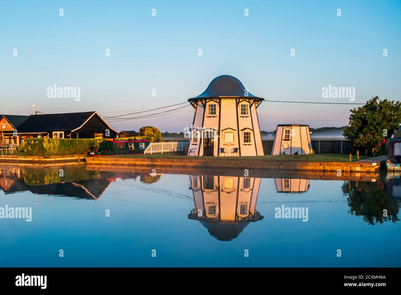 Dutch Tutch, a former helter skelter, reflected in the River Thurne at Potter Heigham, Norfolk Broads. Stock Photo