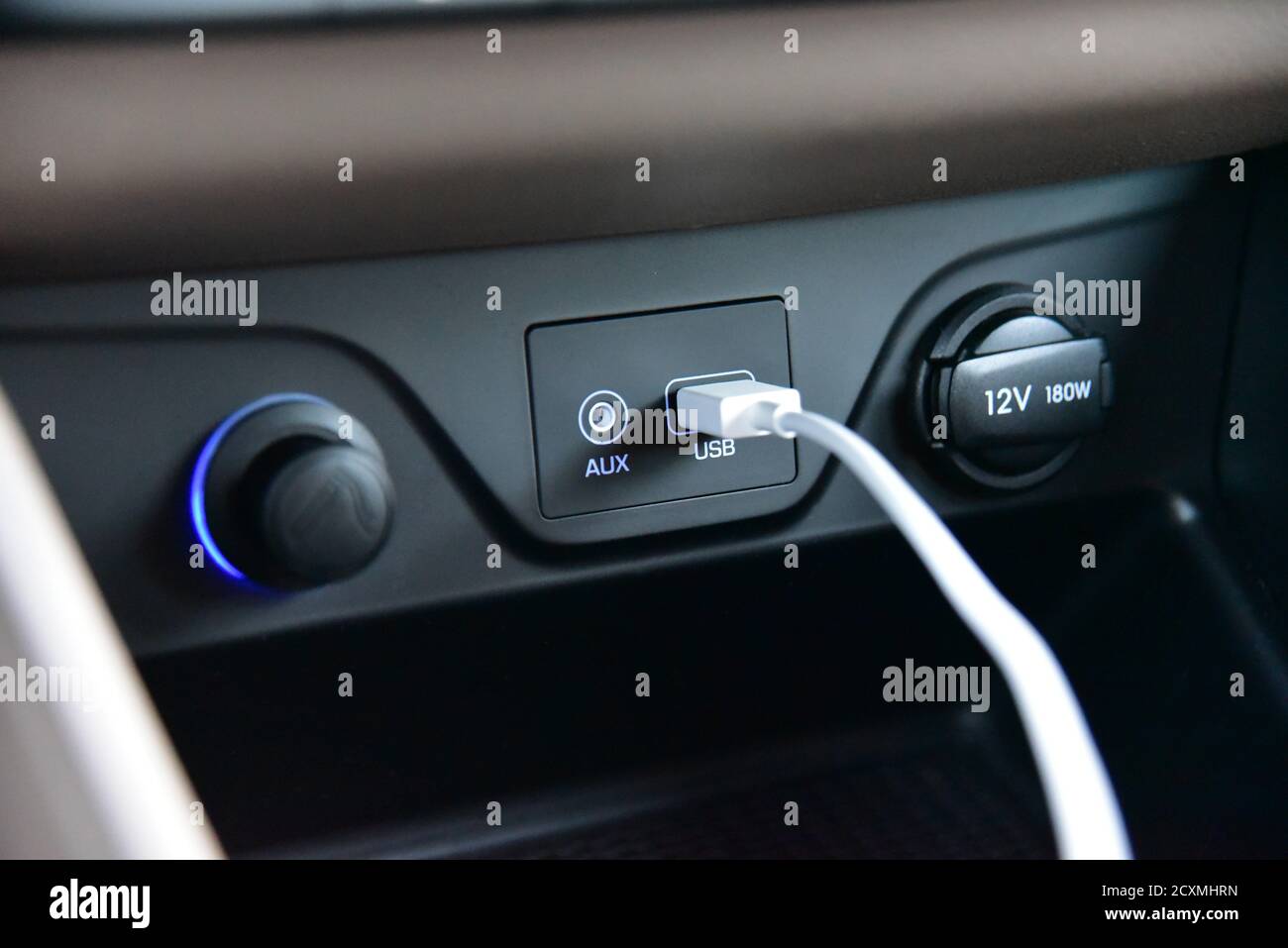 Connected USB cable into the USB port on the car dashboard Stock Photo