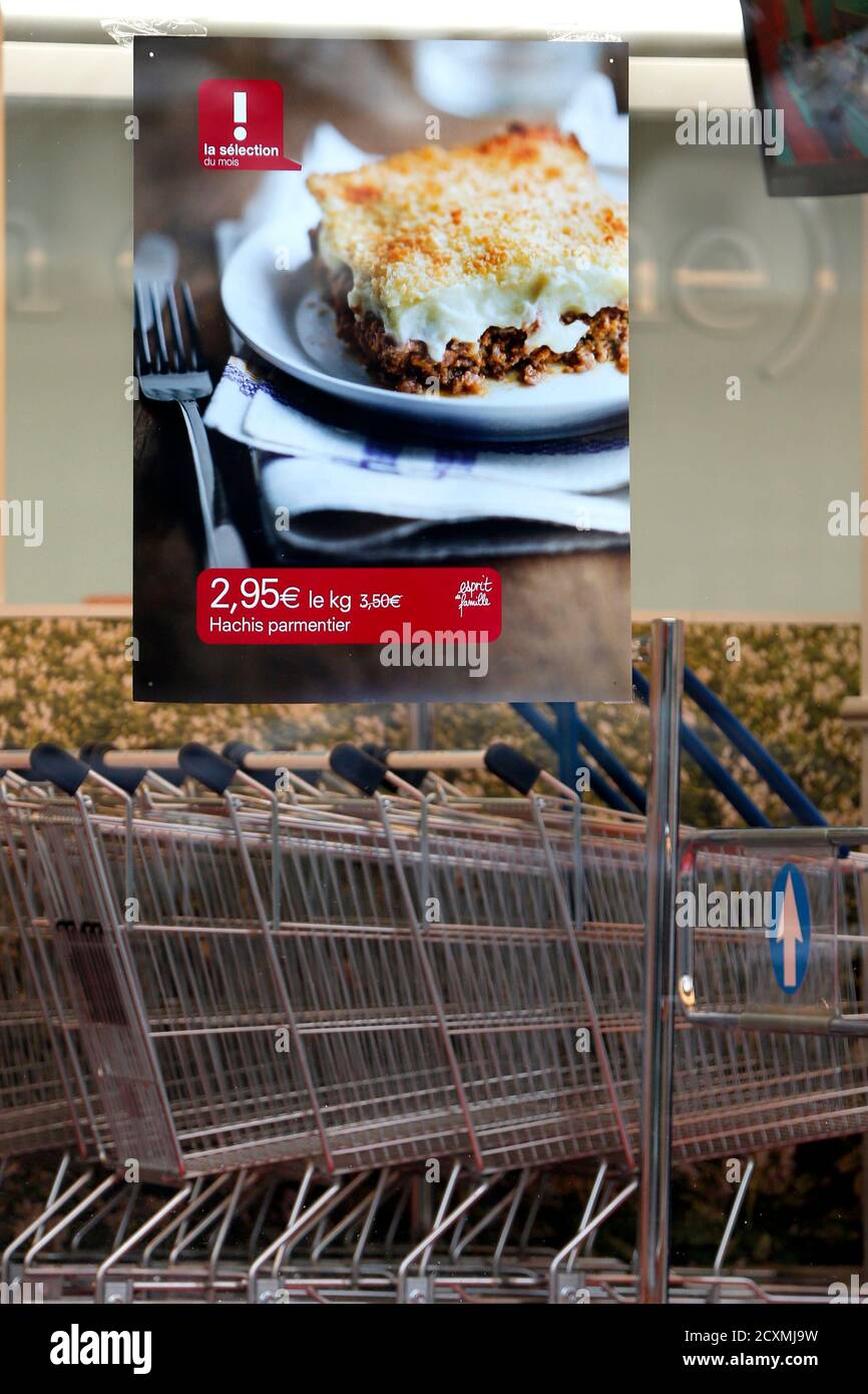 A poster advertising hachis Parmentier (shepherd's pie) is seen on the  store front of a Picard frozen food chain store in Vincennes, near Paris,  February 13, 2013. Picard, France's largest frozen food