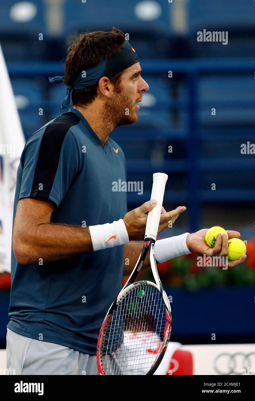 Juan Martin Del Potro of Argentina argues with the chair umpire about a time  violation following a serve to Novak Djokovic of Serbia during their men's  singles semi-final match at the ATP