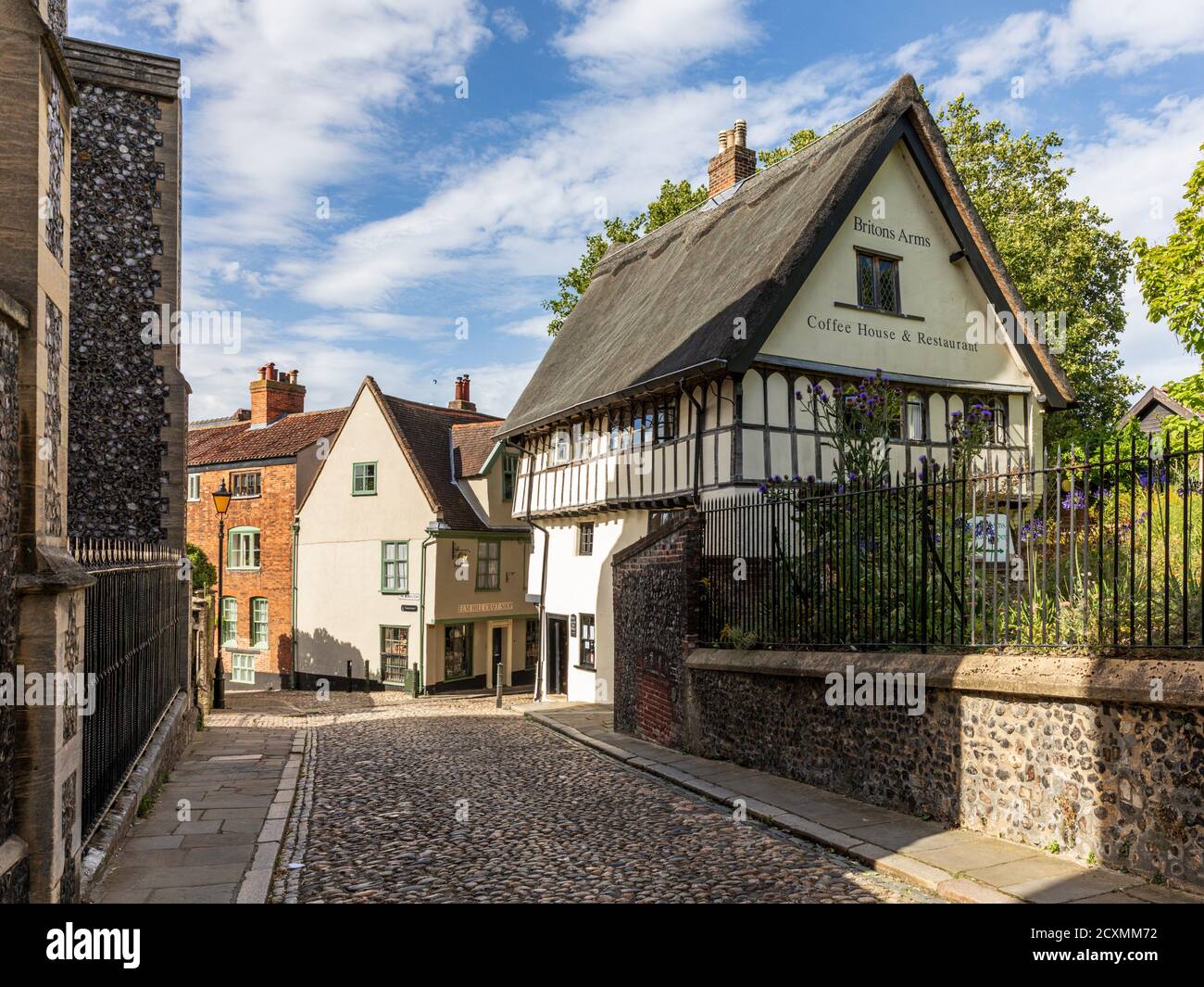 Historic Elm Hill in the old town, a cobbled lane with many buildings dating back to the Tudor period, Norwich, Norfolk, England, UK. Stock Photo